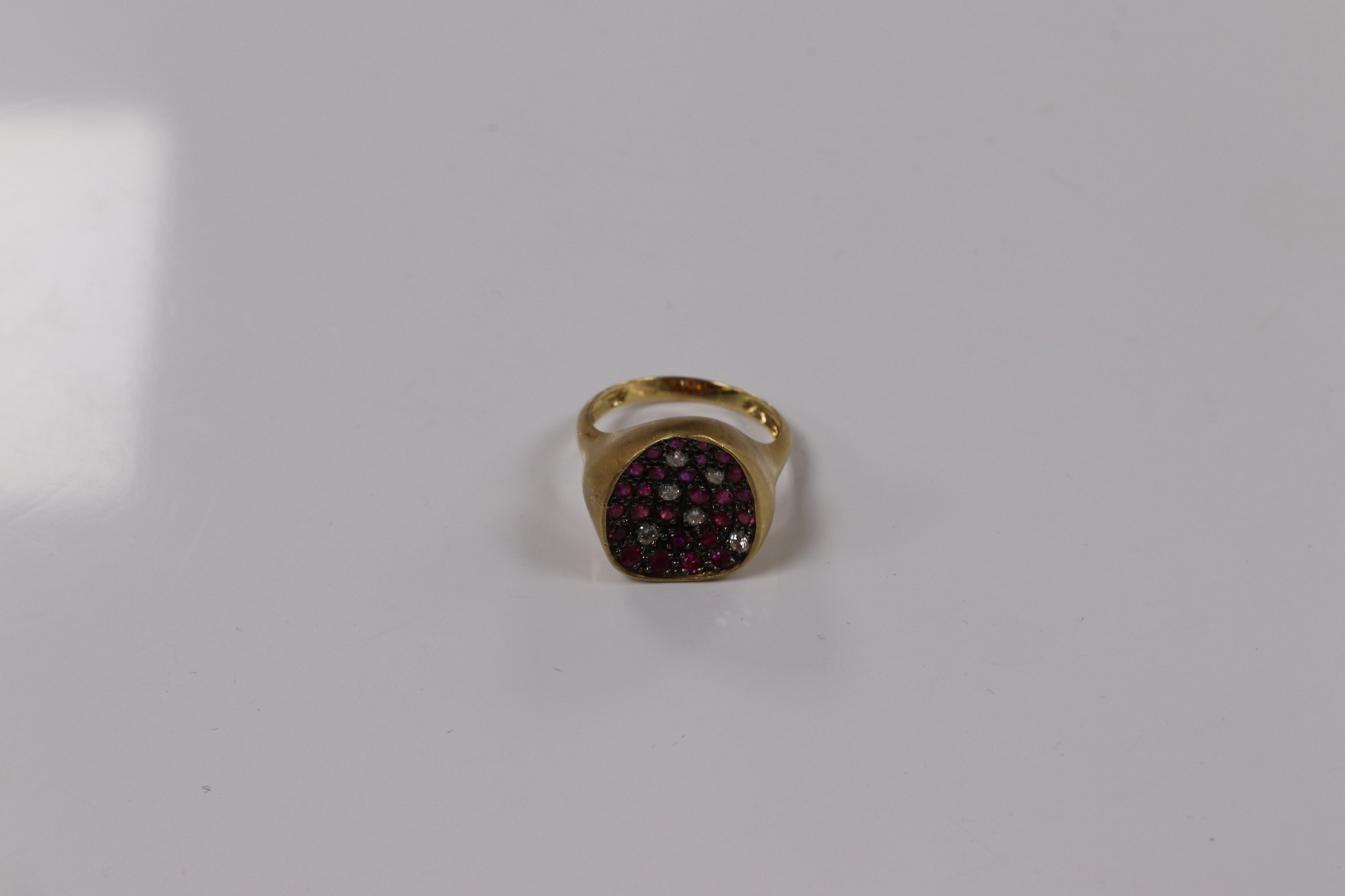 A modern 18k and pave set ruby and diamond set concave dress ring, size O, gross weight 5.4 grams. Condition - fair